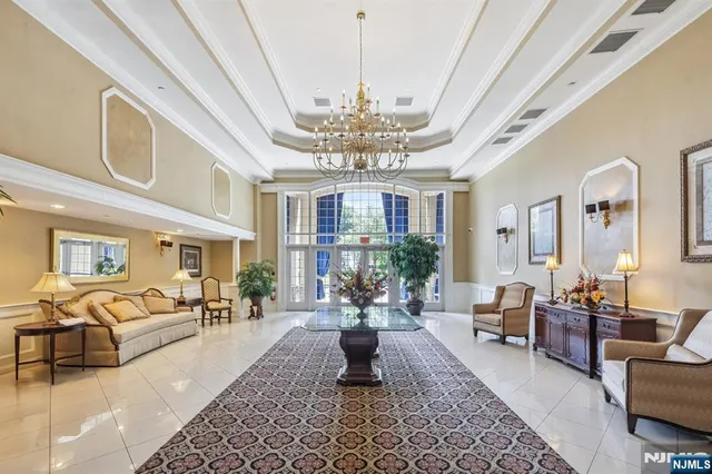 a living room with furniture chandelier and a chandelier