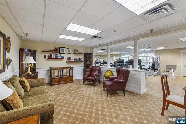 a view of a livingroom with furniture and a rug