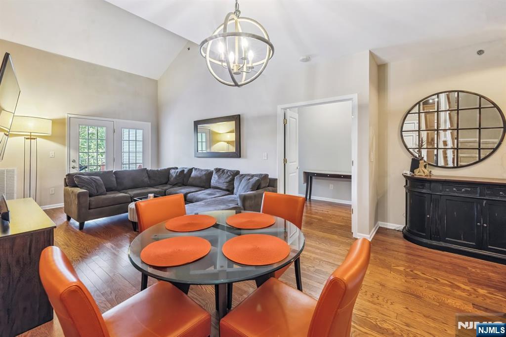 175 Rochelle Avenue, Unit 321 Rochelle Park, NJ 07662 - Photo 7 of 27 a living room with furniture a fireplace a rug and a window