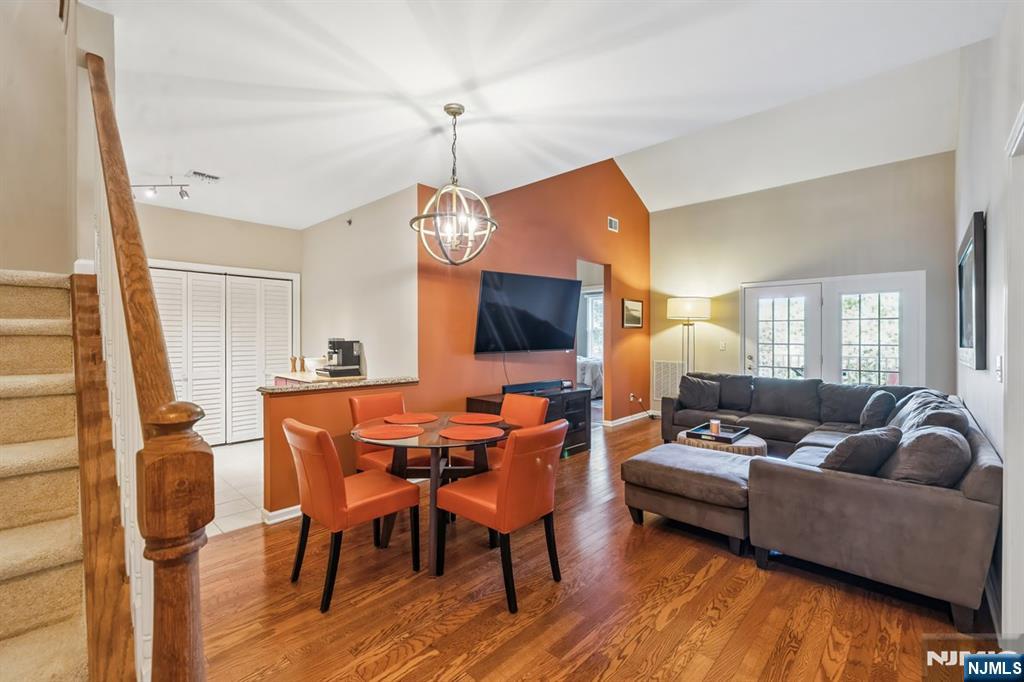 175 Rochelle Avenue, Unit 321 Rochelle Park, NJ 07662 - Photo 8 of 27 a living room with furniture and a flat screen tv