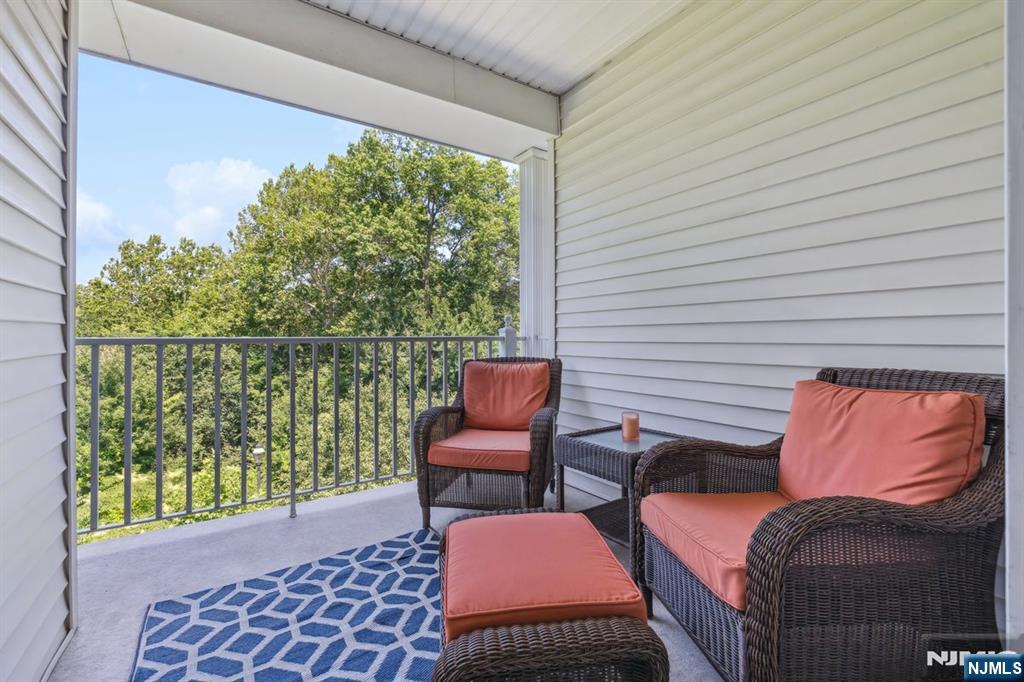 175 Rochelle Avenue, Unit 321 Rochelle Park, NJ 07662 - Photo 10 of 27 a balcony with furniture and a potted plant
