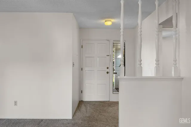a view of a livingroom with a kitchen