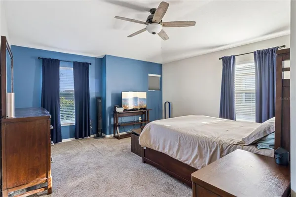 a spacious bathroom with a shower sink and mirror