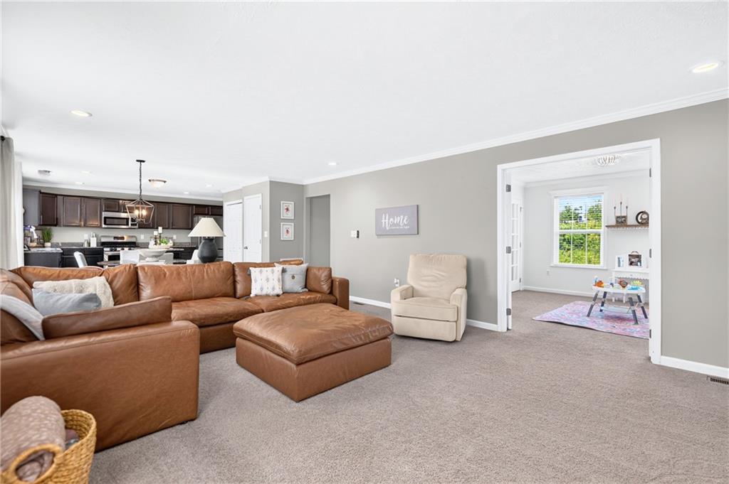 259 Foxwood Road Coraopolis, PA 15108 - Photo 16 of 49 Gather with family and friends in this inviting family room featuring plush wall-to-wall carpeting.