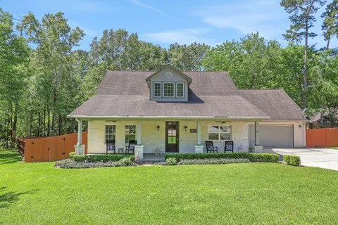 a aerial view of a house with a yard