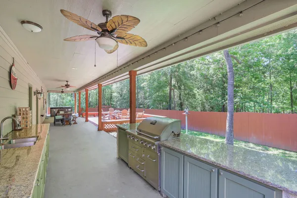 a kitchen with a sink and a stove