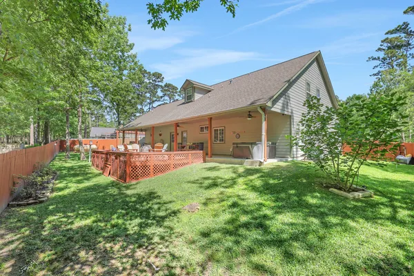 an aerial view of a house with yard