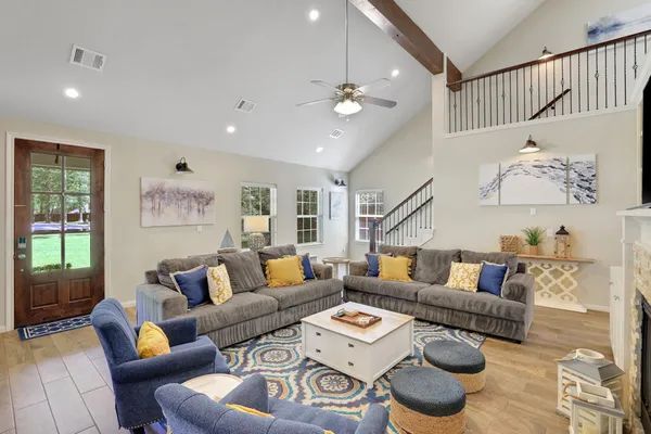 a living room with furniture and a large window