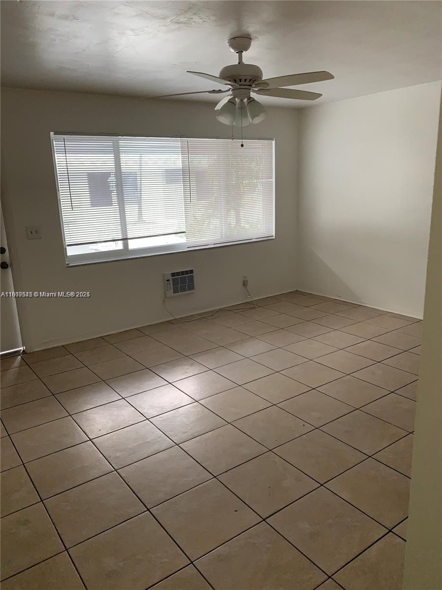 2225 Van Buren Street, Unit 2 Hollywood, FL 33020 - Photo 4 of 5 a view of an empty room with a window