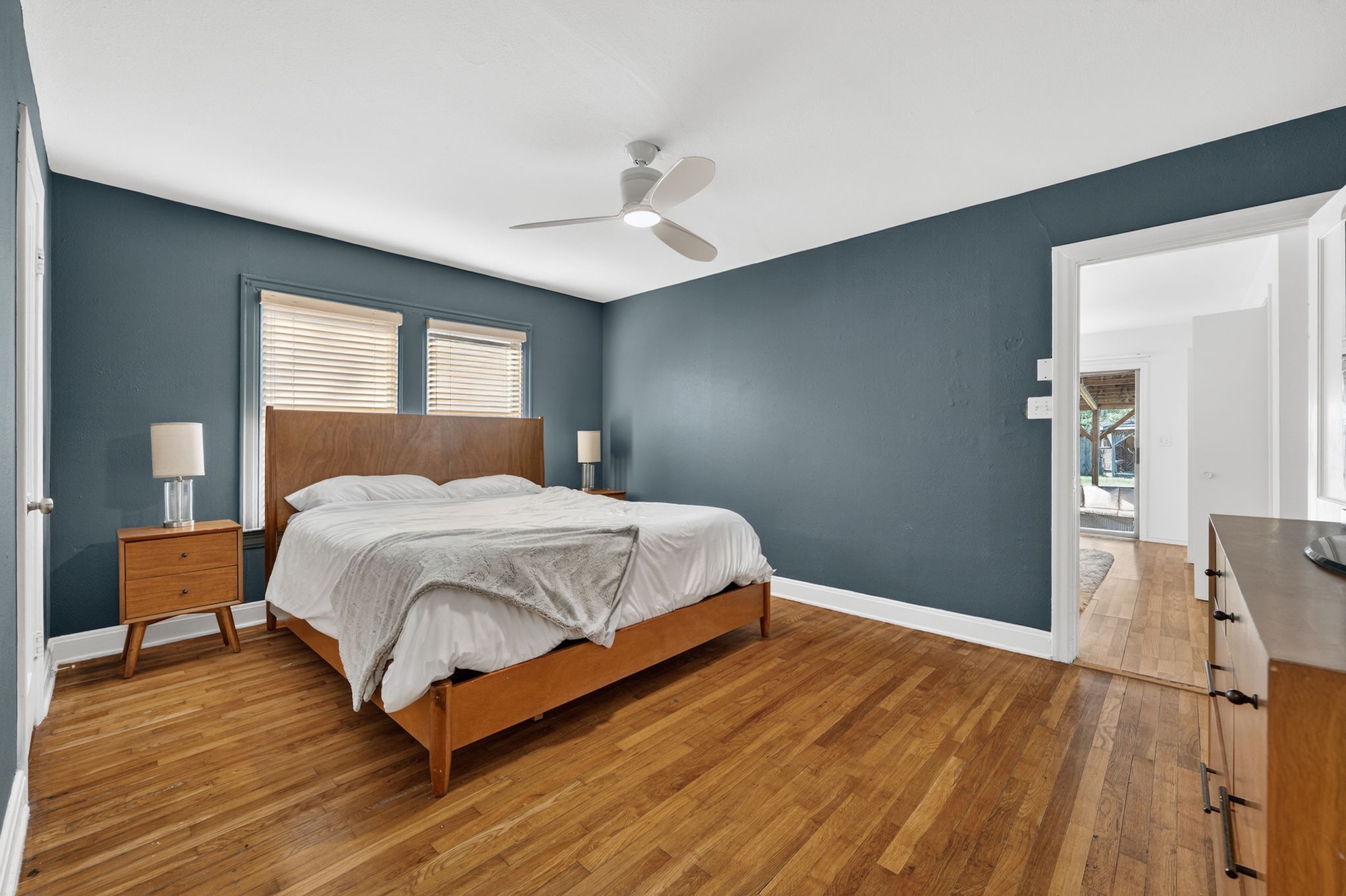 609 Fletcher Street Austin, TX 78704 - Photo 12 of 25 a bedroom with a bed and wooden floor