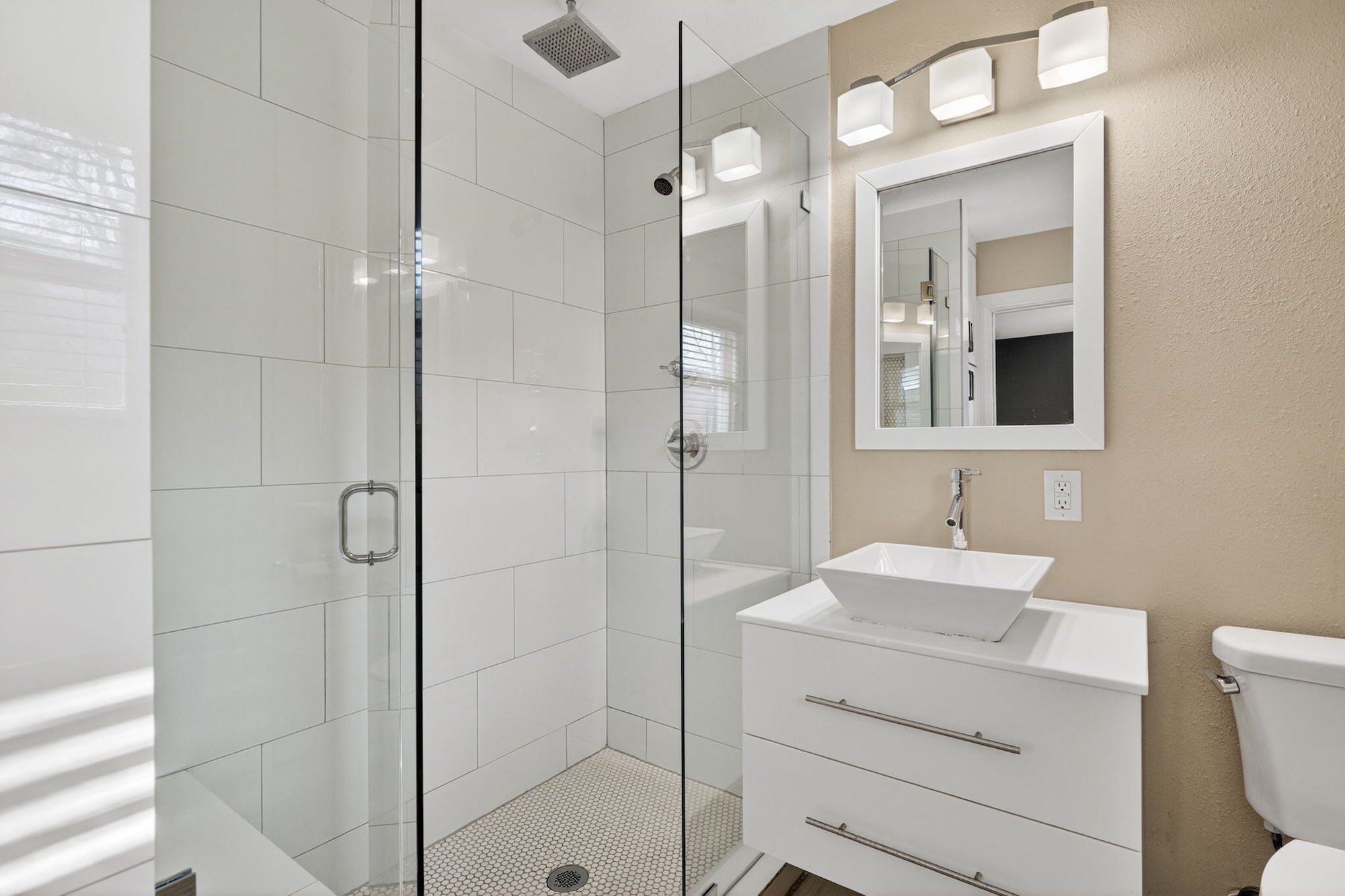 609 Fletcher Street Austin, TX 78704 - Photo 14 of 25 a bathroom with a sink a toilet and shower