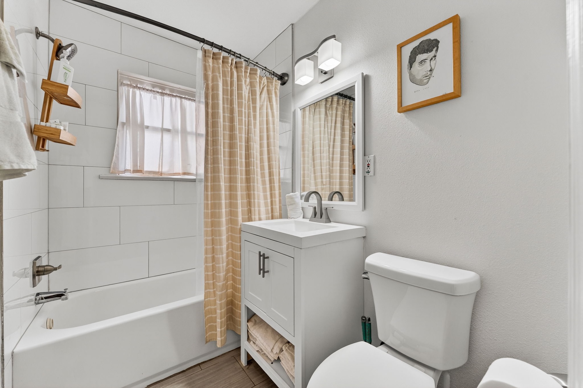 609 Fletcher Street Austin, TX 78704 - Photo 16 of 25 a white toilet sitting next to a bathroom sink and tub