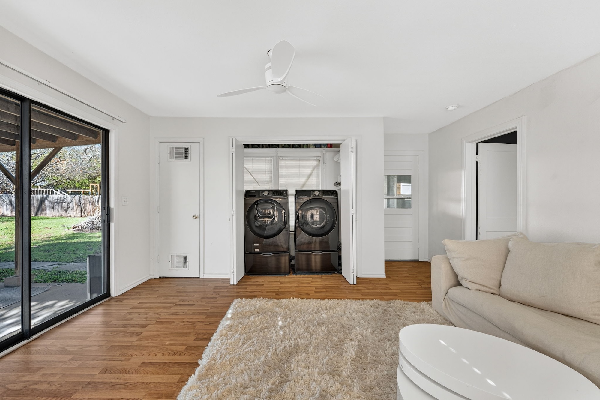 609 Fletcher Street Austin, TX 78704 - Photo 18 of 25 a bedroom with a bed and a dresser next to a window