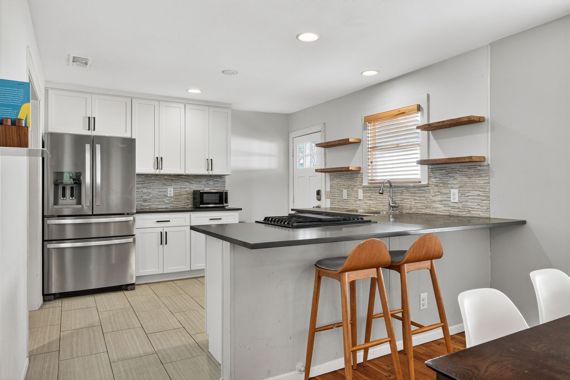 609 Fletcher Street Austin, TX 78704 - Photo 9 of 25 a kitchen with stainless steel appliances granite countertop a stove a sink and a refrigerator