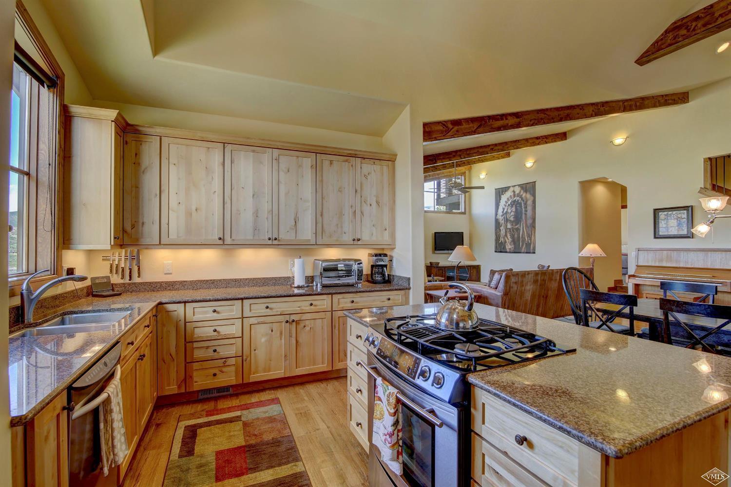 46 Hollis Lane Edwards, CO 81632 - Photo 11 of 25 a kitchen with a stove a sink and a refrigerator