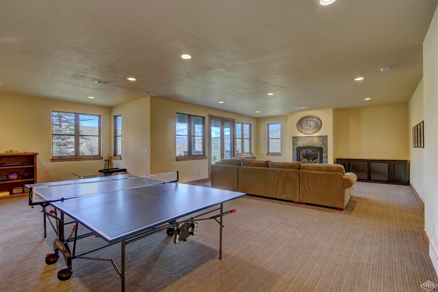 46 Hollis Lane Edwards, CO 81632 - Photo 18 of 25 a living room with a table chairs and a wooden floor