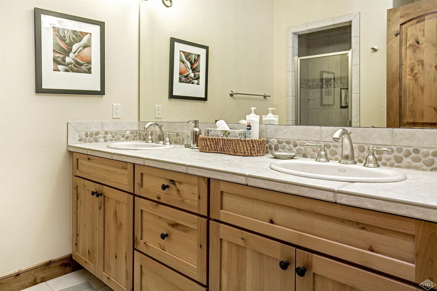 46 Hollis Lane Edwards, CO 81632 - Photo 20 of 25 a bathroom with a sink and a mirror