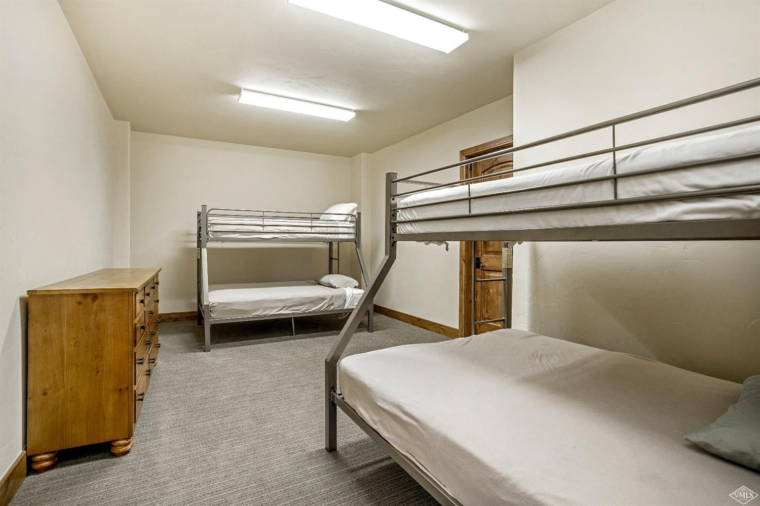 46 Hollis Lane Edwards, CO 81632 - Photo 21 of 25 a bedroom with a bed and a dresser