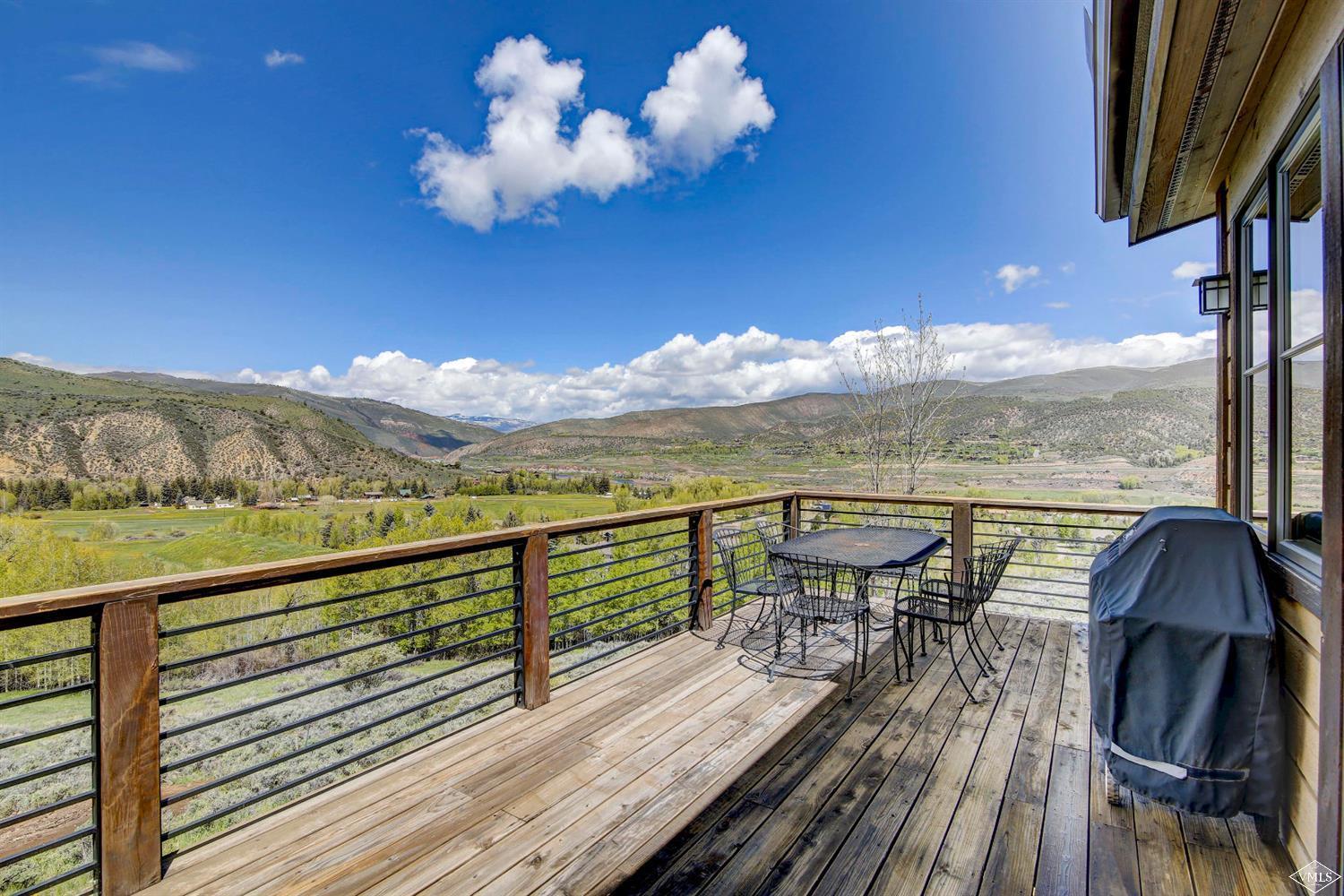 46 Hollis Lane Edwards, CO 81632 - Photo 5 of 25 a view of a balcony with table and chairs and wooden floor