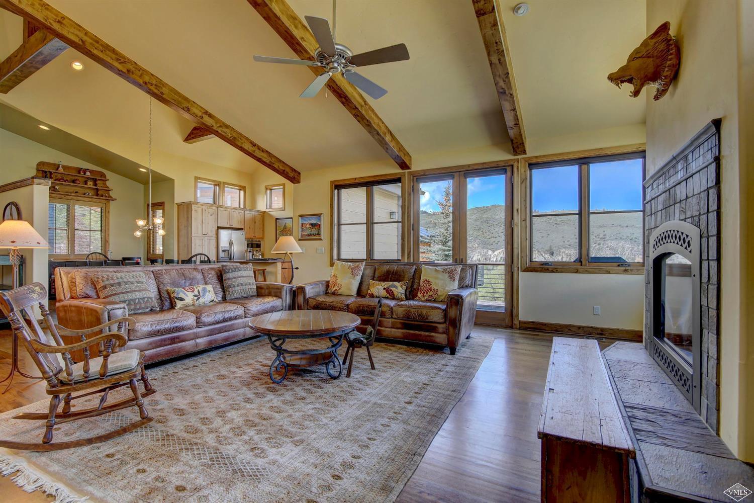 46 Hollis Lane Edwards, CO 81632 - Photo 6 of 25 a living room with furniture and a floor to ceiling window