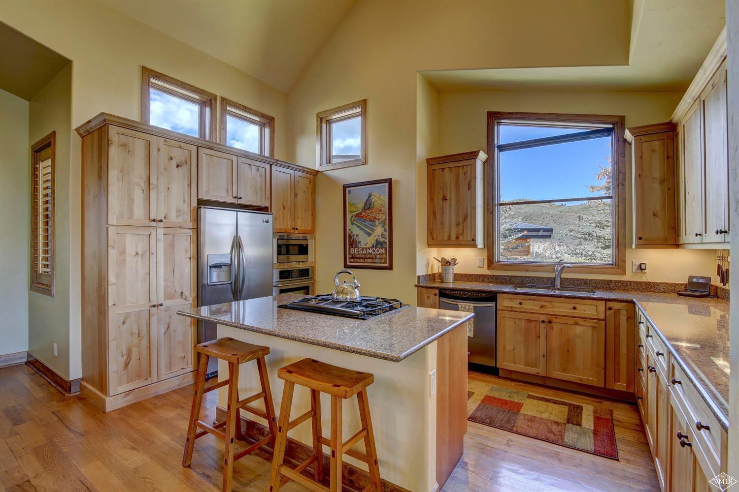46 Hollis Lane Edwards, CO 81632 - Photo 10 of 25 a kitchen with stainless steel appliances granite countertop a stove a refrigerator and a stove