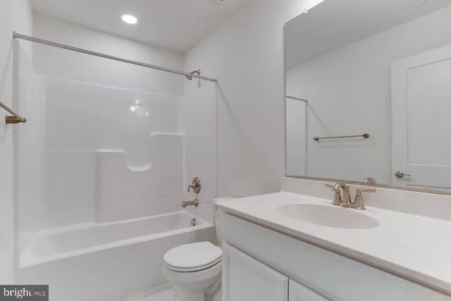 a bathroom with a sink toilet and a bathtub