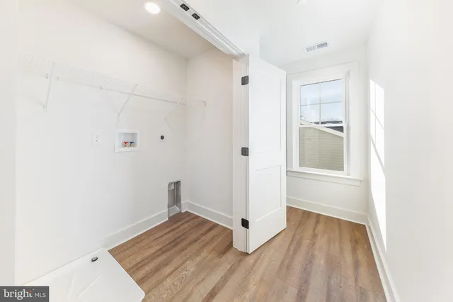 a view of porch with wooden floor and floor to ceiling window