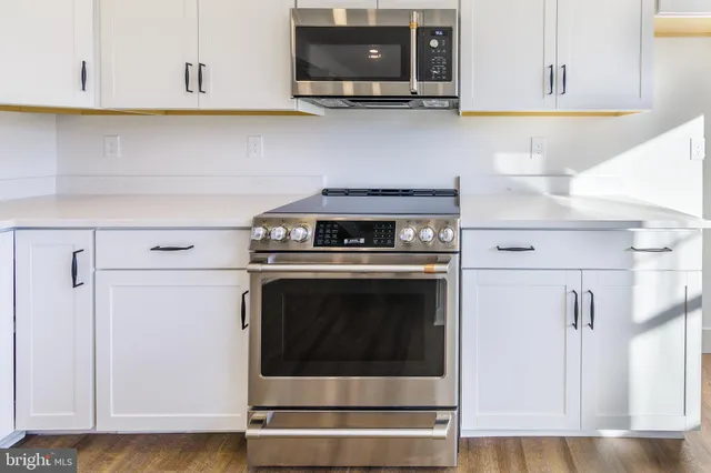 a bathroom with a sink toilet and mirror