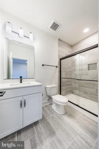 a view of an empty room and a window