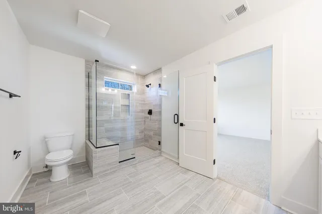 a view of a yard with wooden fence