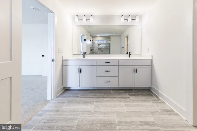 a view of front door of house with a yard