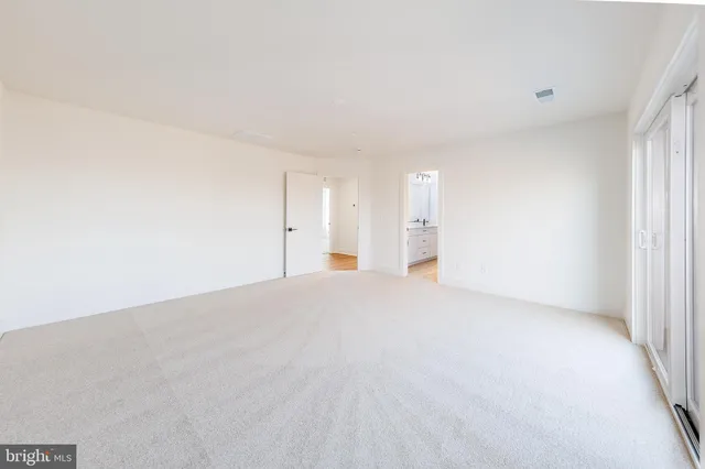 a view of a lake in middle of forest