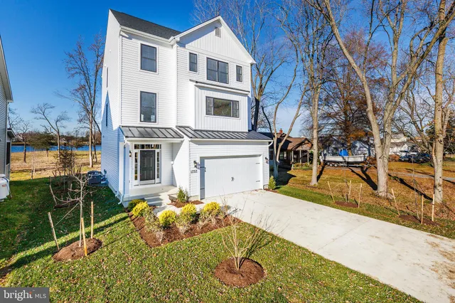a view of staircase with white walls and a window
