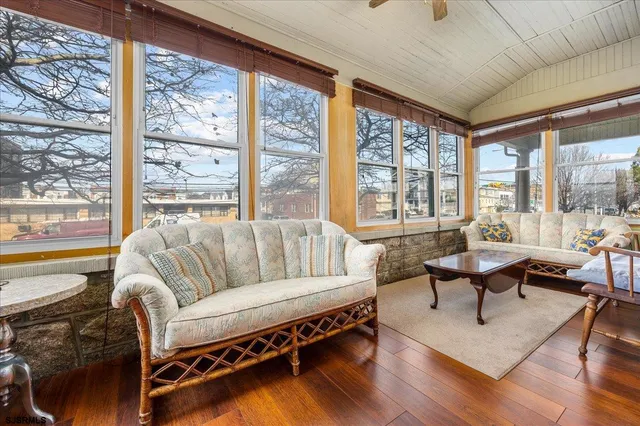 a view of a dining room with furniture and a chandelier
