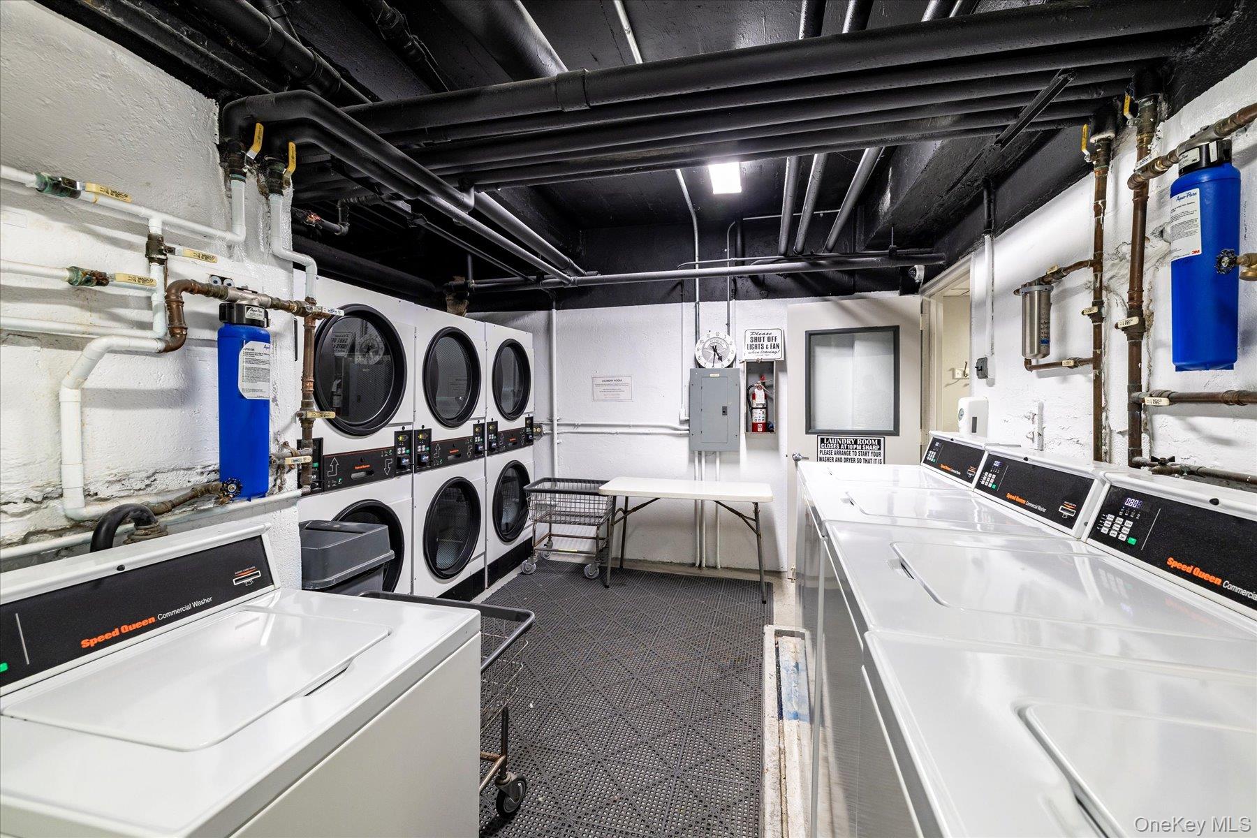 560 West Broadway, Unit 4R Long Beach, NY 11561 - Photo 18 of 26 a utility room with dryer and washer