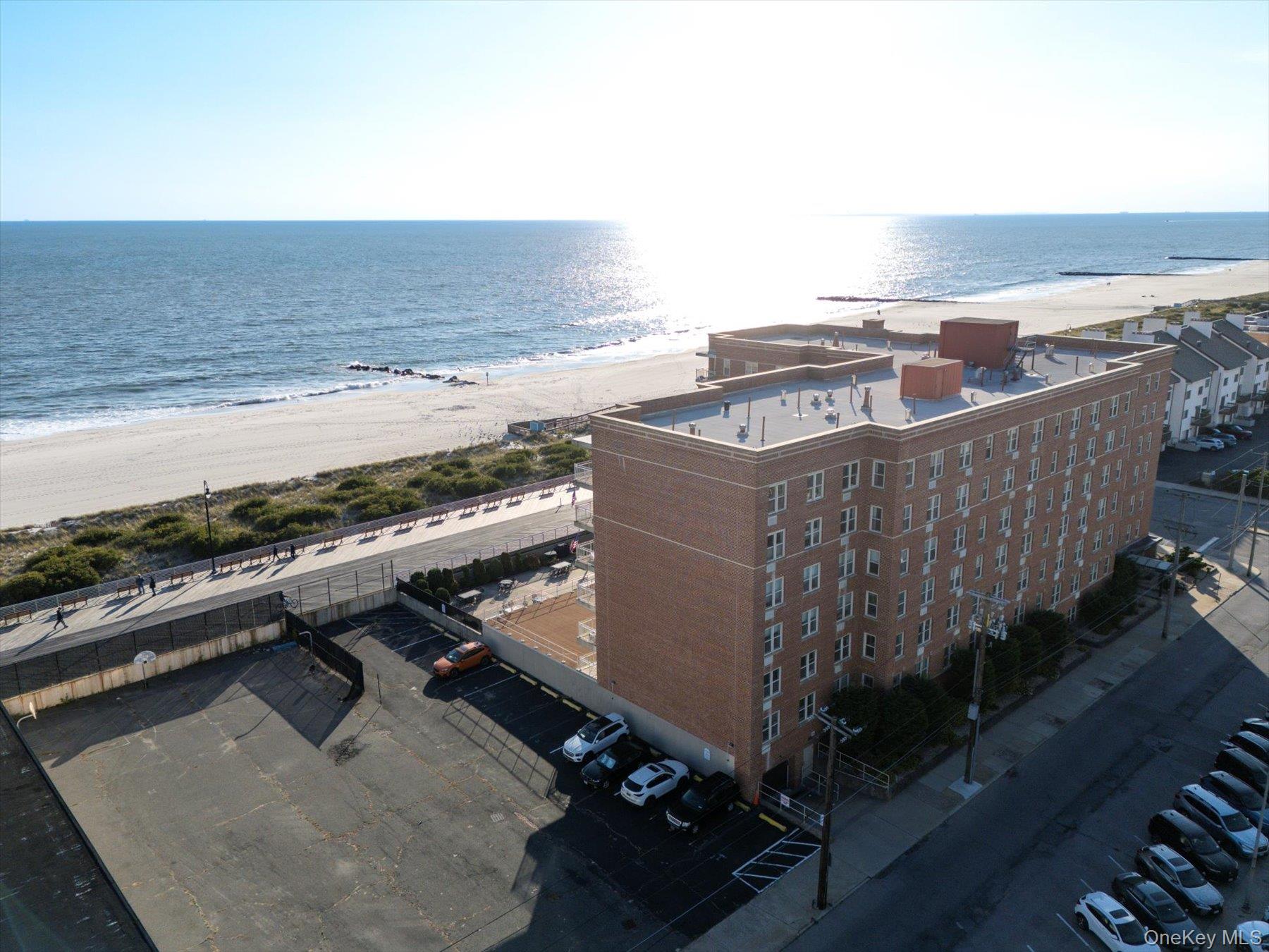 560 West Broadway, Unit 4R Long Beach, NY 11561 - Photo 23 of 26 a view of a terrace with wooden floor and ocean view