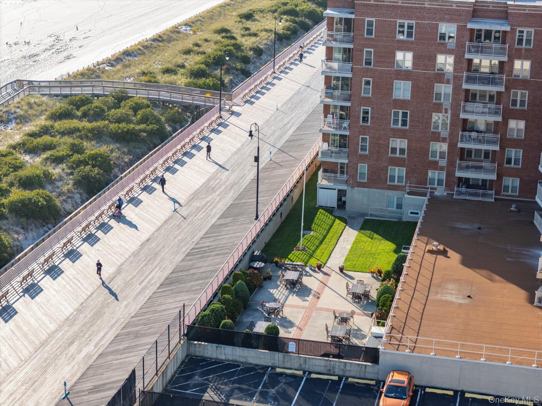 560 West Broadway, Unit 4R Long Beach, NY 11561 - Photo 25 of 26 a view of swimming pool with outdoor seating and lake