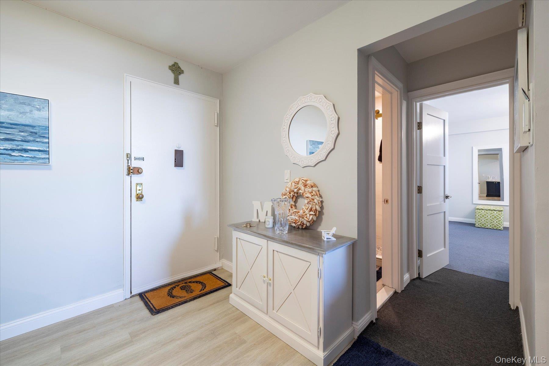 560 West Broadway, Unit 4R Long Beach, NY 11561 - Photo 3 of 26 a view of room with furniture and wooden floor