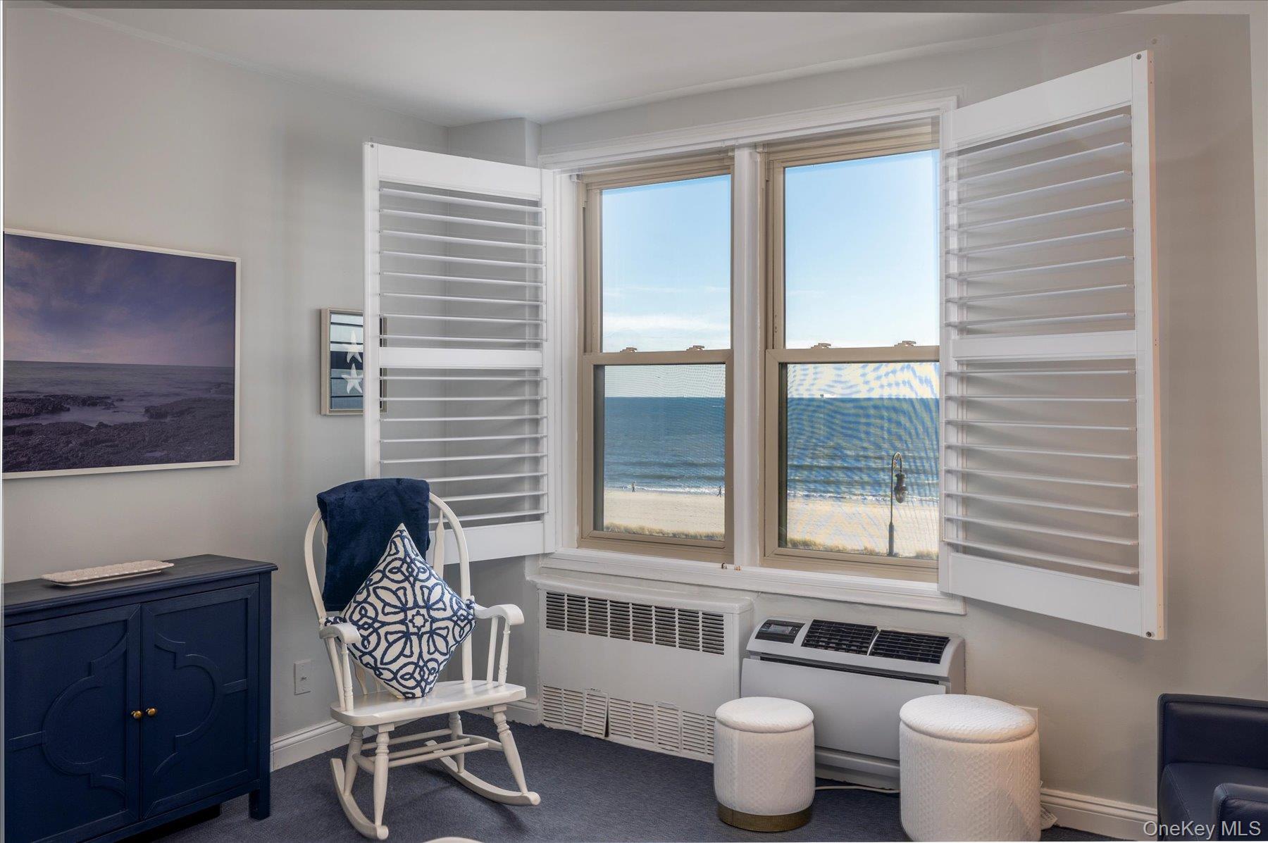 560 West Broadway, Unit 4R Long Beach, NY 11561 - Photo 7 of 26 a living room with furniture and a window