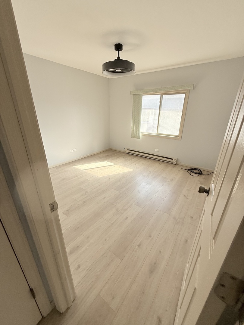 1925 Canal Street, Unit 3D Blue Island, IL 60406 - Photo 12 of 21 a view of an empty room and a window