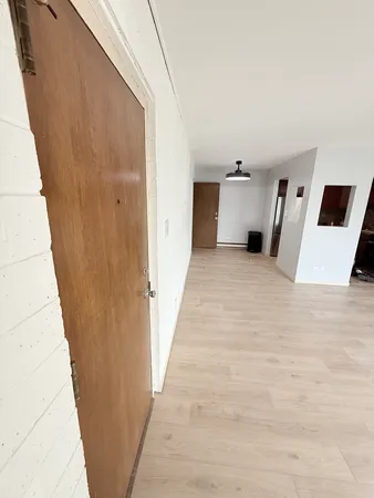 a view of a room with a hallway