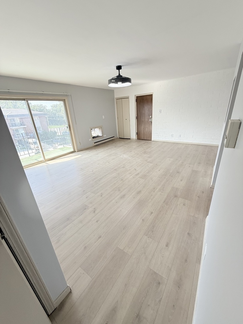1925 Canal Street, Unit 3D Blue Island, IL 60406 - Photo 14 of 21 a view of an empty room with a window