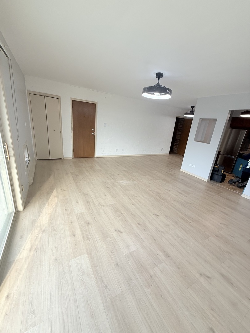 1925 Canal Street, Unit 3D Blue Island, IL 60406 - Photo 16 of 21 a view of empty room with floor to ceiling window