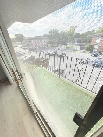 a view of balcony with furniture