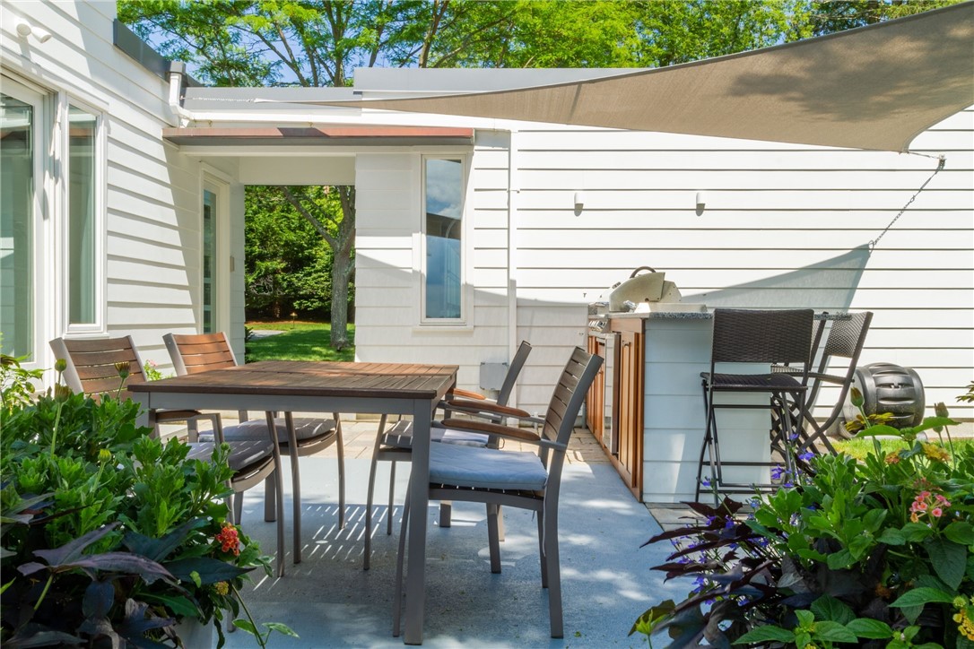 151 Ferry Road Bristol, RI 02809 - Photo 11 of 49 A new garage connects to the house and outdoor kitchen and dining