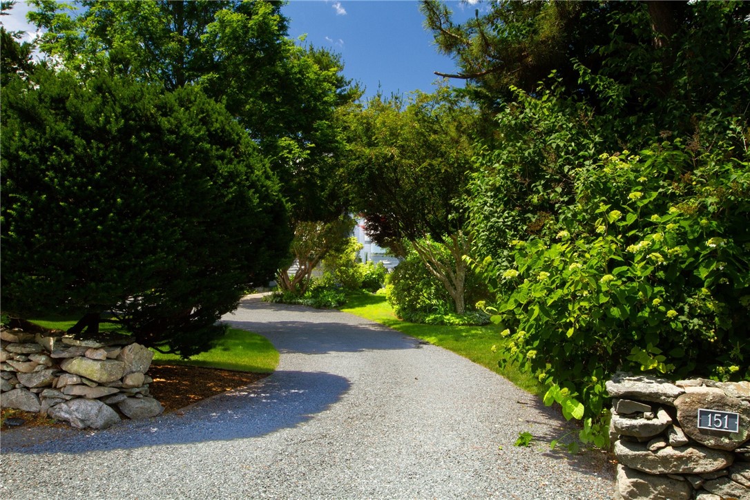151 Ferry Road Bristol, RI 02809 - Photo 42 of 49 Lushly planted driveway for sumptuous privacy