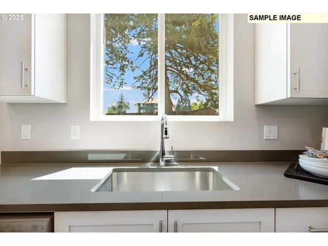 a kitchen with a sink and a window
