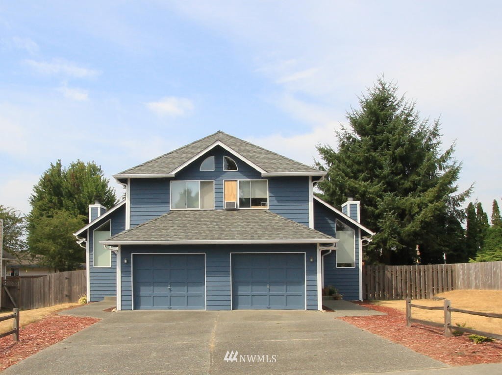 2900 Northeast 8th Street Renton, WA 98056 - Photo 1 of 25 a front view of a house with a garage