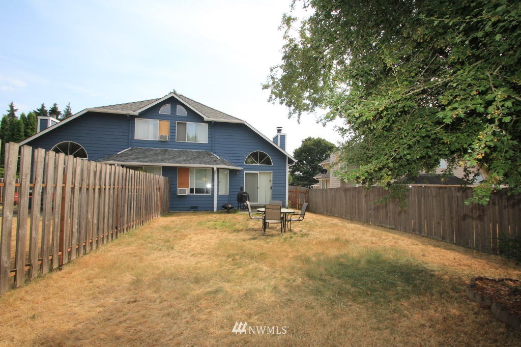 2900 Northeast 8th Street Renton, WA 98056 - Photo 23 of 25 a front view of a house with a yard and garage