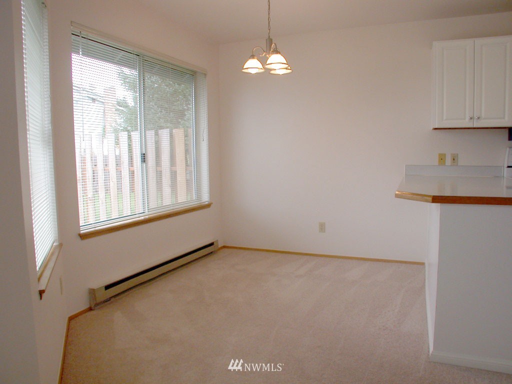 2900 Northeast 8th Street Renton, WA 98056 - Photo 4 of 25 a view of an empty room with a window